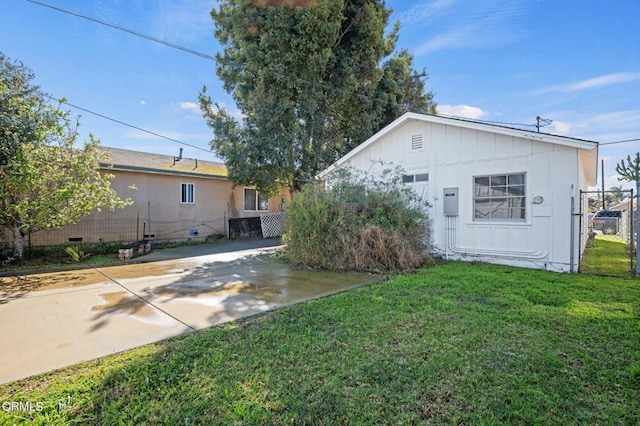 rear view of property with a yard and crawl space