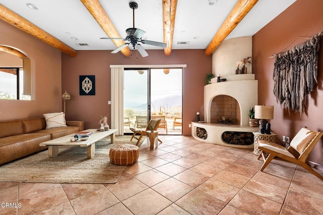 tiled living area featuring a wealth of natural light, visible vents, and beam ceiling