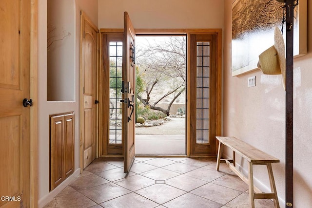 foyer with light tile patterned floors