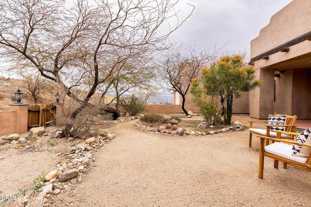 view of yard featuring a patio and fence