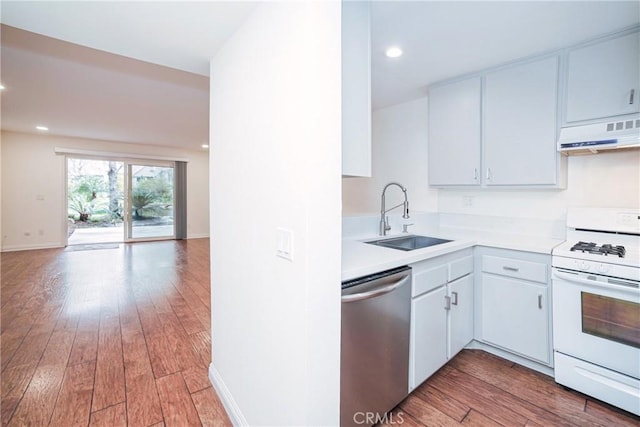 kitchen with under cabinet range hood, a sink, stainless steel dishwasher, white gas range oven, and light countertops