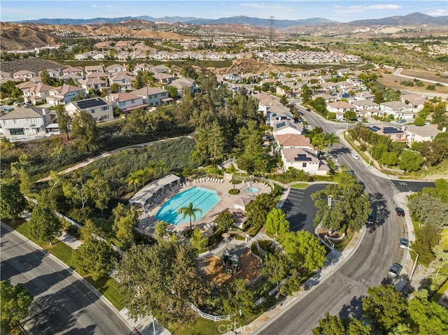 27950 Periwinkle Ln, Valencia, CA 91354 - aerial view of property's location featuring a mountain backdrop and nearby suburban area