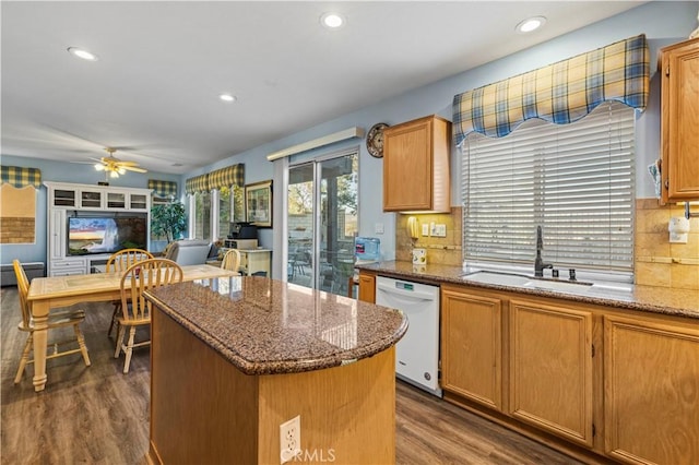 27950 Periwinkle Ln, Valencia, CA 91354 - kitchen with dishwasher, dark wood-style floors, a kitchen island, ceiling fan, and tasteful backsplash