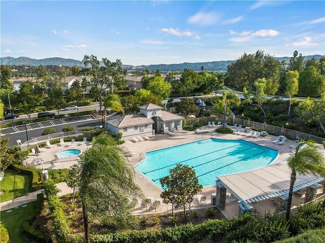 27950 Periwinkle Ln, Valencia, CA 91354 - community pool featuring a patio, a community hot tub, and a mountain view