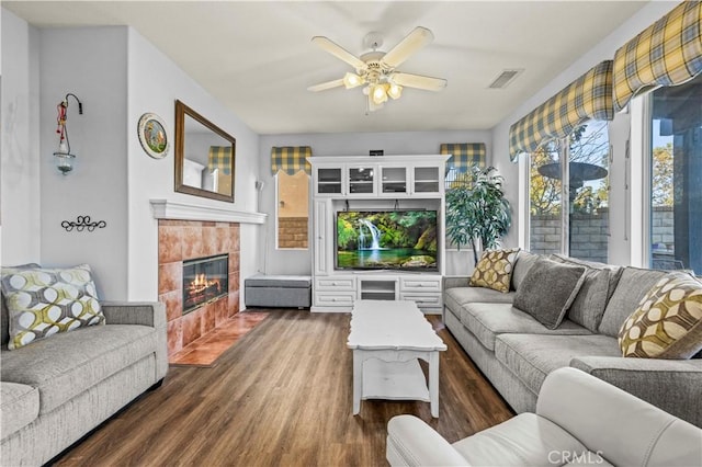 27950 Periwinkle Ln, Valencia, CA 91354 - living area featuring dark wood finished floors, a tile fireplace, and ceiling fan