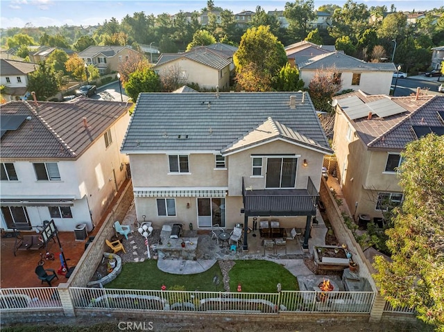 27950 Periwinkle Ln, Valencia, CA 91354 - back of property featuring a fenced backyard, a residential view, an outdoor fire pit, stucco siding, and a patio area