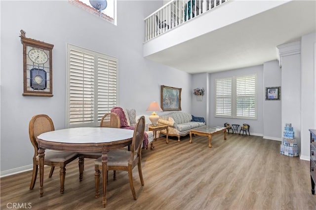 27950 Periwinkle Ln, Valencia, CA 91354 - dining space featuring wood finished floors and a towering ceiling