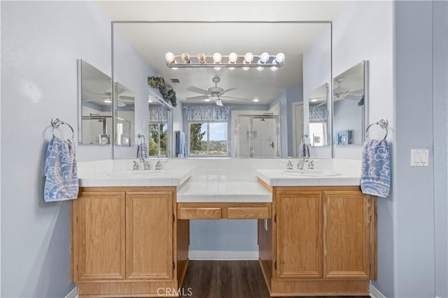 27950 Periwinkle Ln, Valencia, CA 91354 - full bath with a ceiling fan, a stall shower, double vanity, and wood finished floors