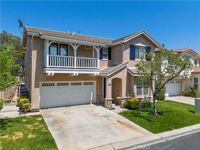27950 Periwinkle Ln, Valencia, CA 91354 - view of front facade with an attached garage, driveway, stucco siding, and a balcony