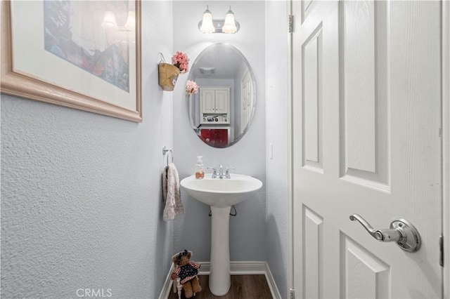 27950 Periwinkle Ln, Valencia, CA 91354 - bathroom with baseboards and wood finished floors