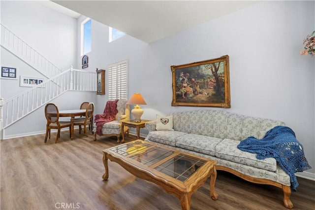 27950 Periwinkle Ln, Valencia, CA 91354 - living room with wood finished floors, stairs, and a towering ceiling
