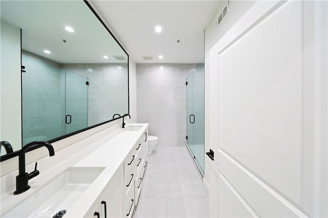 bathroom with tile patterned floors, visible vents, recessed lighting, and a sink