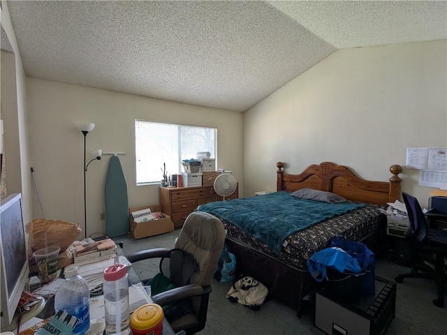 carpeted bedroom with vaulted ceiling and a textured ceiling