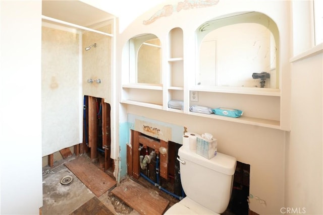 bathroom featuring toilet and a shower