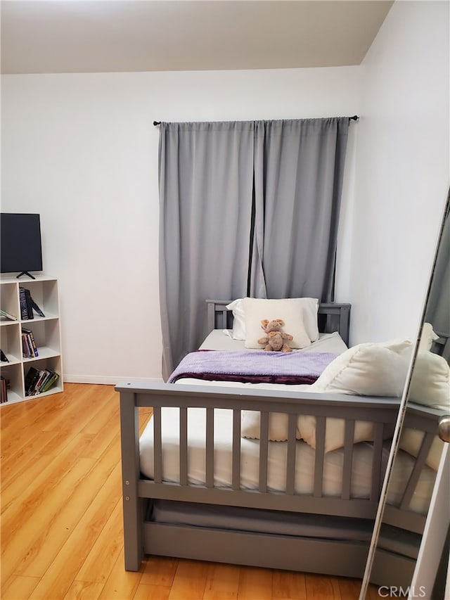 bedroom with light wood-style floors