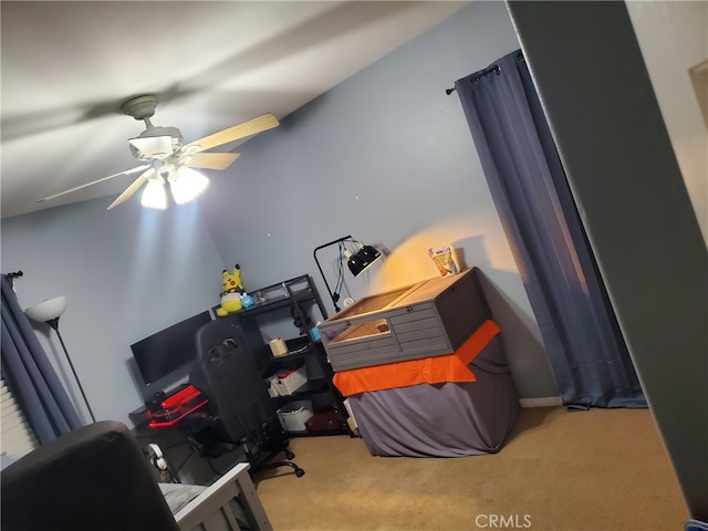 home office with carpet floors and ceiling fan