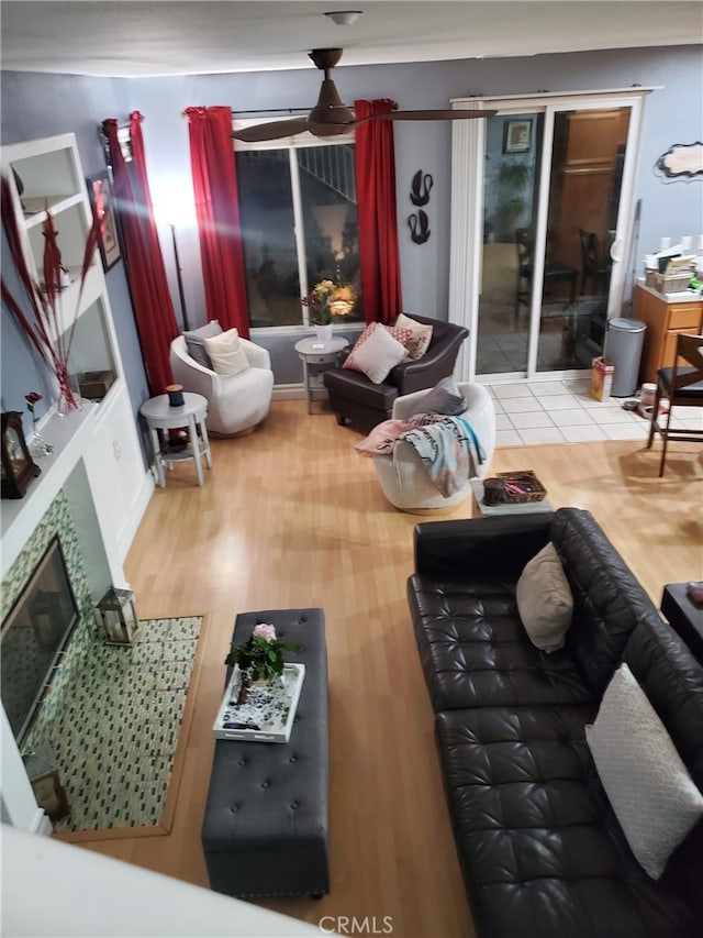 living room with wood finished floors and a fireplace