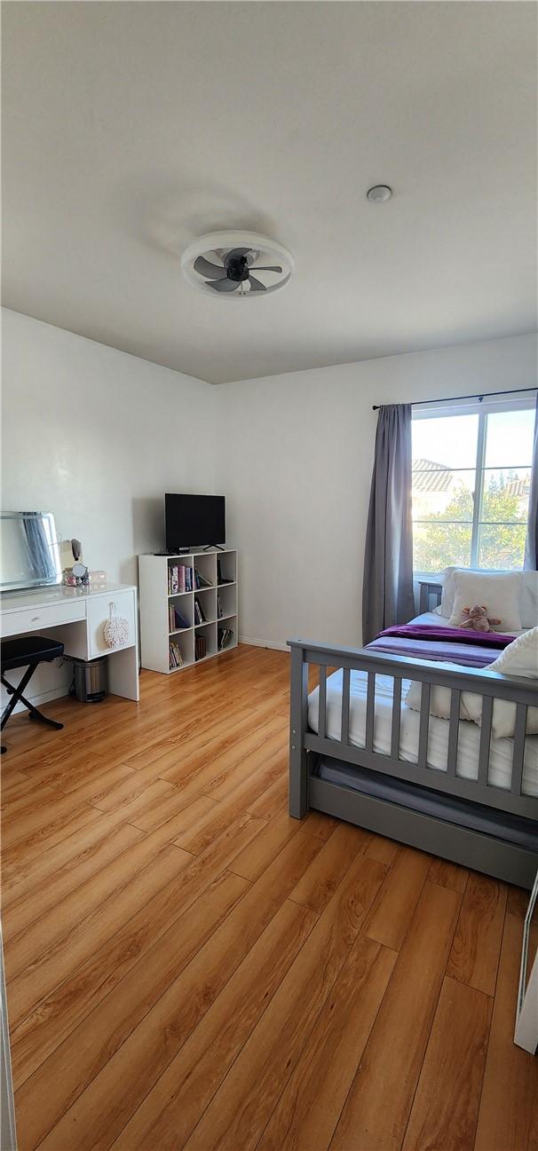 bedroom with light wood finished floors