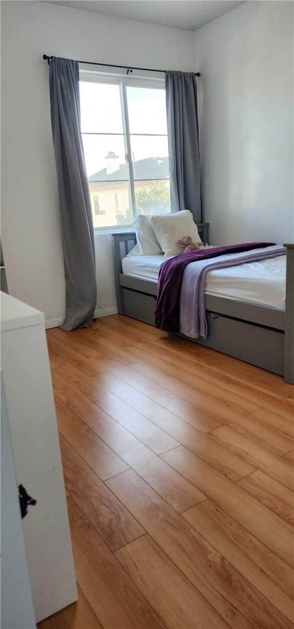 bedroom featuring light wood-style floors