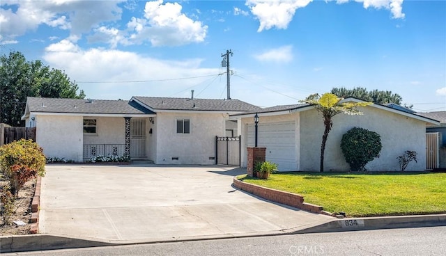 single story home with stucco siding, an attached garage, concrete driveway, and a front lawn