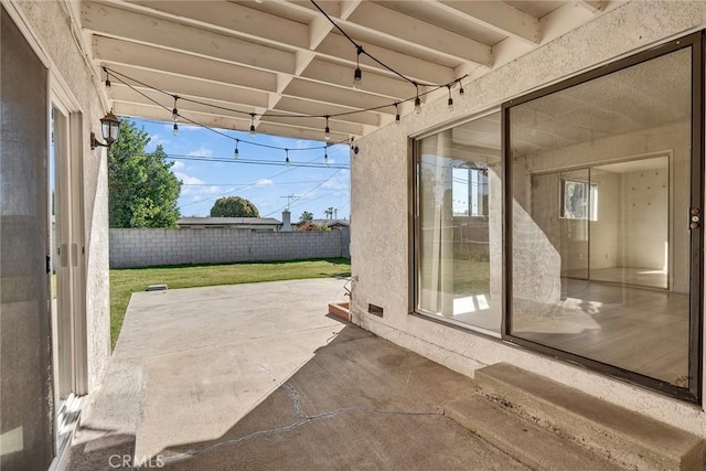 view of patio featuring fence