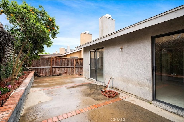 view of patio / terrace with fence