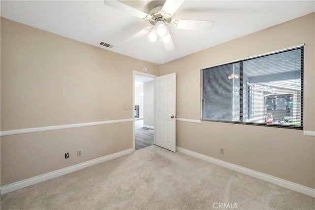 unfurnished bedroom featuring carpet, visible vents, and baseboards