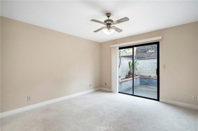 unfurnished room with ceiling fan, baseboards, and light carpet