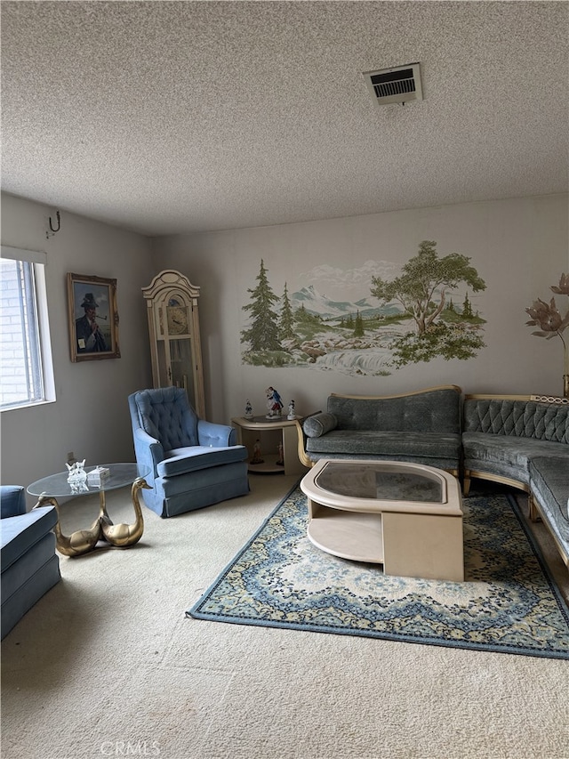 carpeted living area with visible vents and a textured ceiling