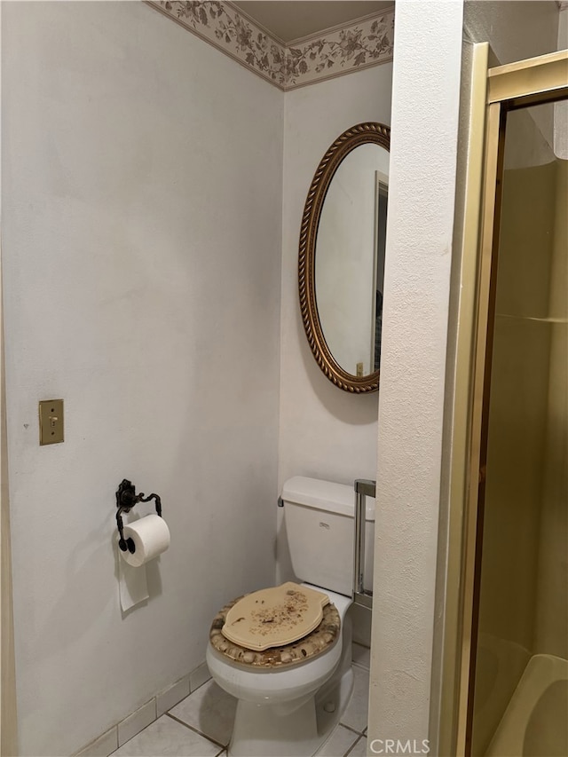 full bathroom with a shower, toilet, and tile patterned flooring