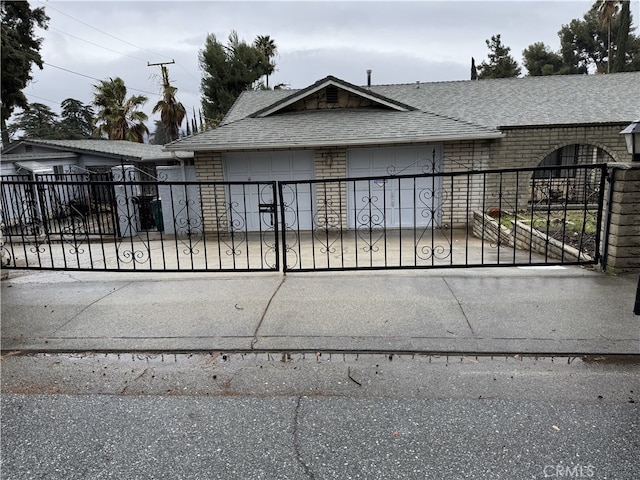 view of gate featuring a fenced front yard