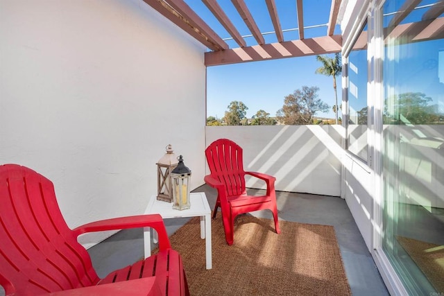 balcony featuring a pergola