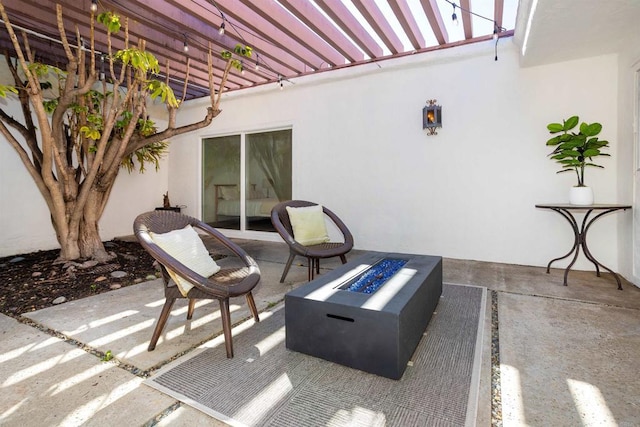 view of patio with an outdoor fire pit and a pergola