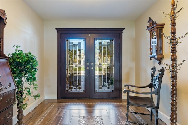 entrance foyer featuring french doors and baseboards