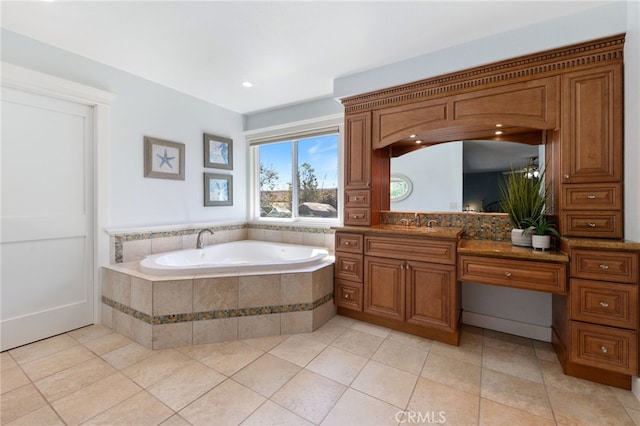 full bathroom featuring a bath, tile patterned flooring, and vanity