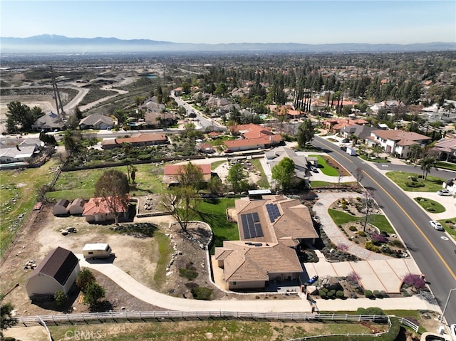 drone / aerial view with a residential view and a mountain view