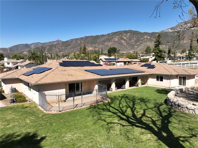 back of house featuring a patio area, stucco siding, a mountain view, and cooling unit