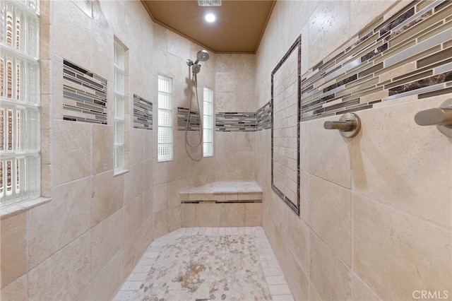 bathroom featuring a tile shower