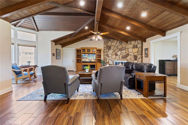 living room featuring wood finished floors, wooden ceiling, and vaulted ceiling with beams