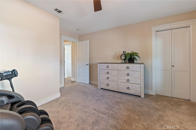 sitting room featuring visible vents, baseboards, ceiling fan, and carpet flooring