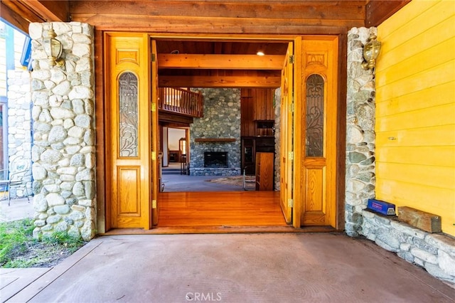 entrance to property featuring stone siding