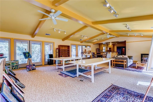 rec room featuring french doors, vaulted ceiling with beams, ceiling fan, track lighting, and carpet floors