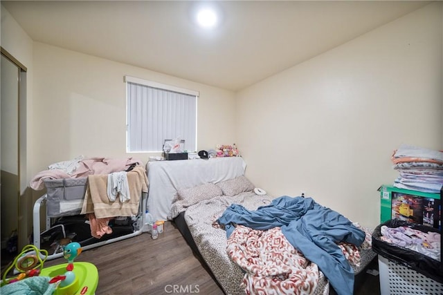 bedroom featuring wood finished floors