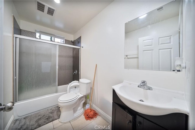 full bathroom featuring tile patterned floors, visible vents, toilet, shower / bath combination with glass door, and vanity