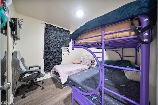 bedroom featuring wood finished floors