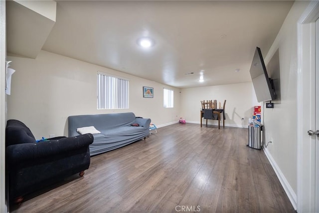 sitting room featuring dark wood finished floors and baseboards