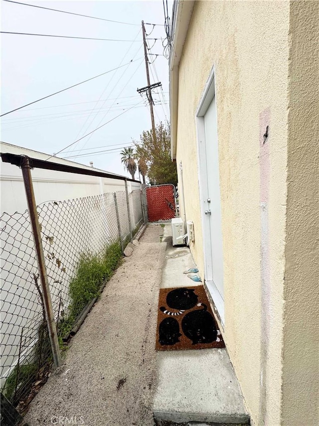 exterior space featuring ac unit and a fenced backyard