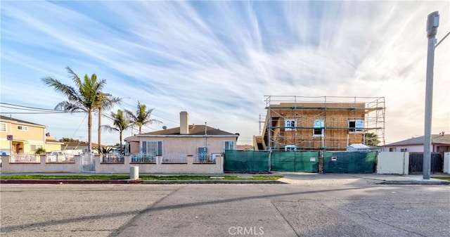 10701 Doty Ave, Inglewood, CA 90303 - view of front of home with a fenced front yard and a chimney