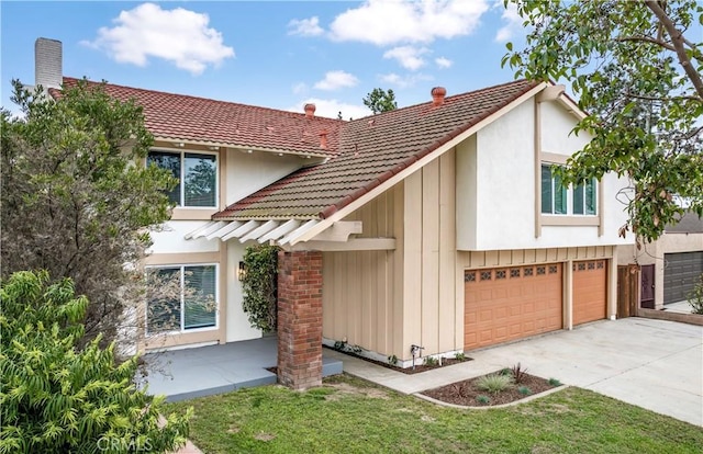 view of front of property featuring stucco siding, driveway, board and batten siding, a garage, and a tiled roof