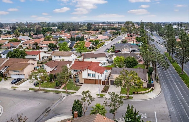 birds eye view of property with a residential view